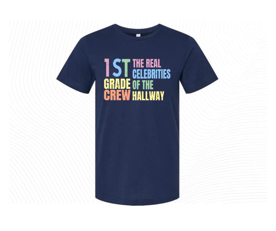 Navy tshirt with colorful digital image with text "1st grade crew. The Real celebrities of the hallway" on front.