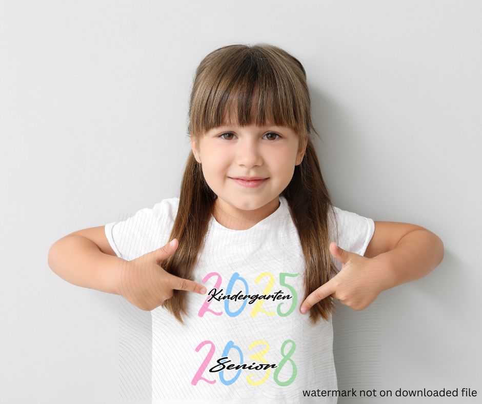 little girl wearing white shirt with 2025 2038 kindergarten to senior image on front on gray background.