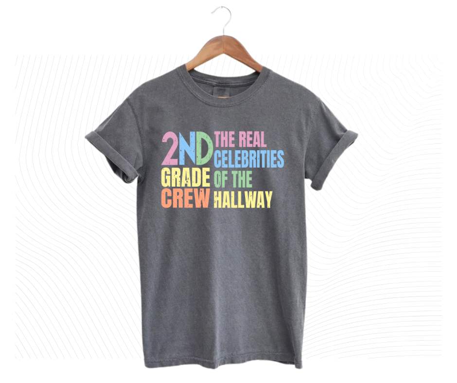 Gray tshirt with colorful digital image with text "2nd grade crew. The Real celebrities of the hallway" on front.