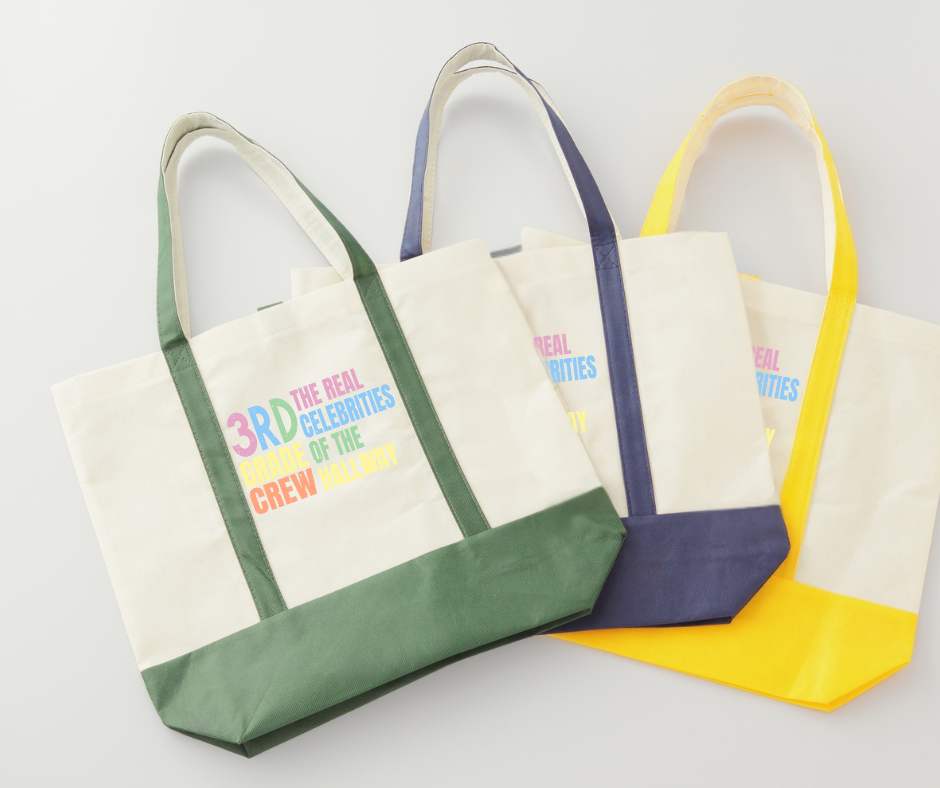 canvas tote bags with colorful digital image with text "3rd grade crew. The Real celebrities of the hallway" on front.
