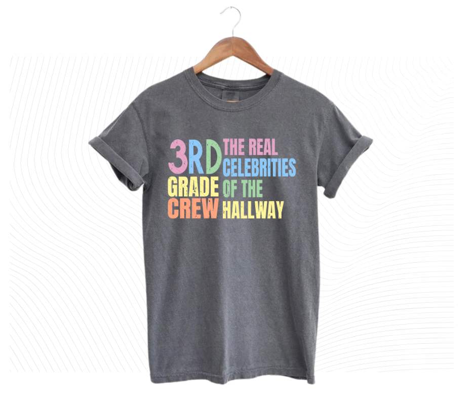 Gray tshirt with colorful digital image with text "3rd grade crew. The Real celebrities of the hallway" on front.