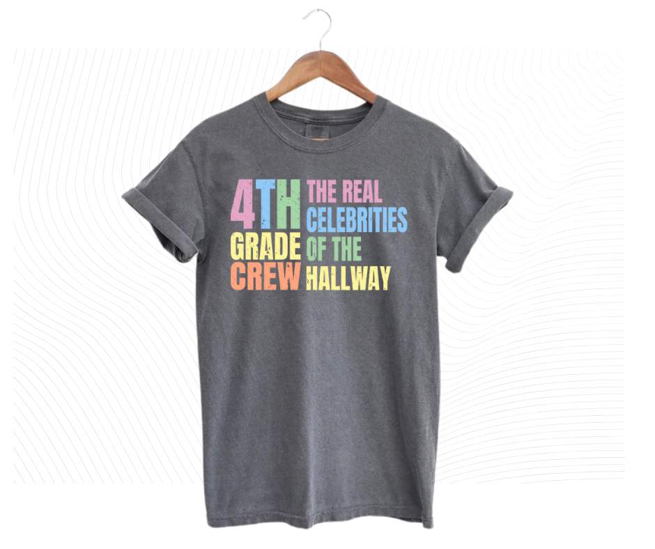 Gray tshirt with colorful digital image with text "4th grade crew. The Real celebrities of the hallway" on front.