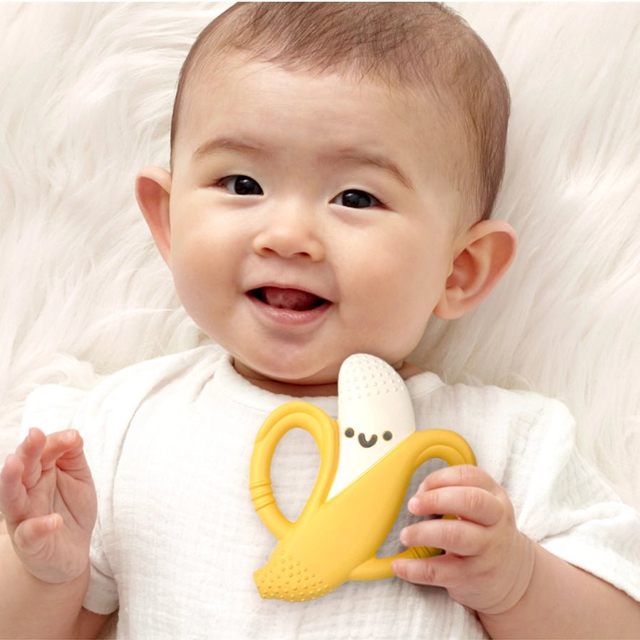 Baby HoldingItzy Ritzy Banana Soft Silicone Teether – BPA-Free – Soft Silicone Baby Teether - Little Gift Nook