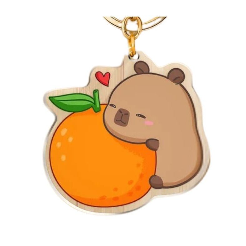 capybara acrylic orange keychain. Double sided. Capybara Acrylic Keychains. Comes with metal keyring and lobster hook. Little Gift Nook.