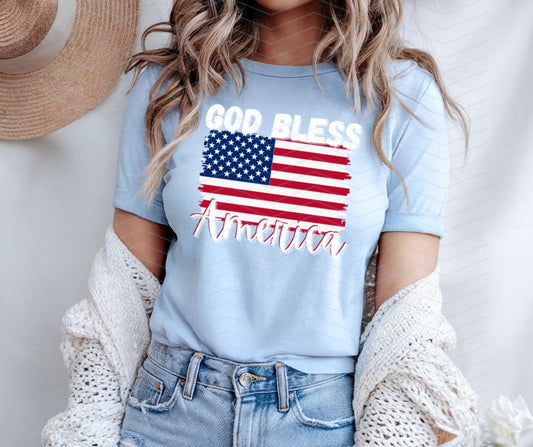 woman in light blue tshirt with our God Bless America 4th of July Flag PNG image on front with watermark - Digital Image Download has no watermark - Little Gift Nook