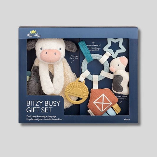 Itzy Ritzy Busy Farm Baby Gift Set. Comes packed in a clear window box showing all pieces. Shown on gray background- Little Gift Nook