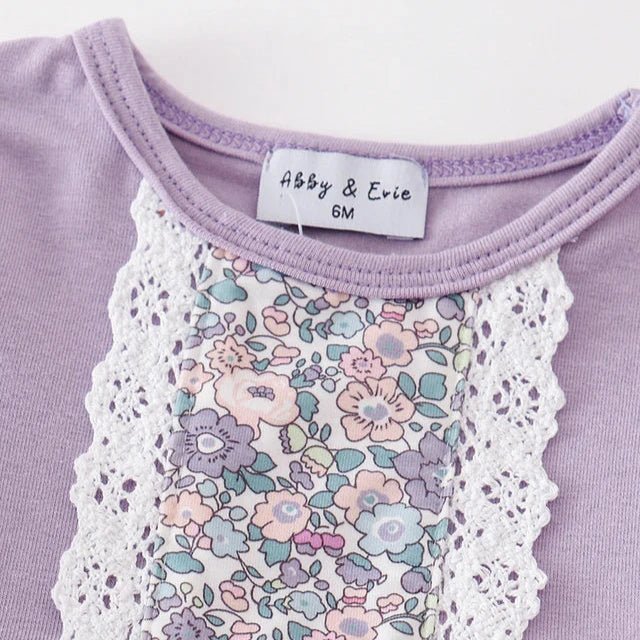 Baby Girl's Lavender Floral Eyelet Ruffle Dress Set. Lavender cotton spandex dress crewneck neckline with white eyelet and floral strip down center.