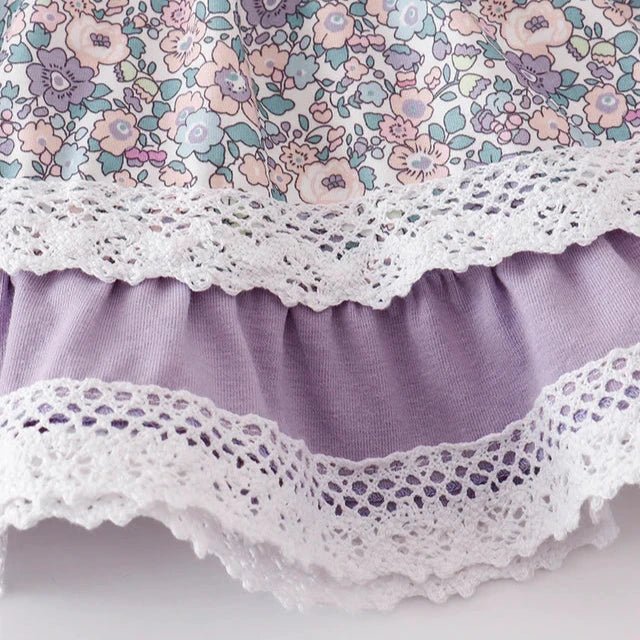 Baby Girl's Lavender Floral Eyelet Ruffle Dress Set. Lavender pink and green floral print dress with eyelet trim at hem.
