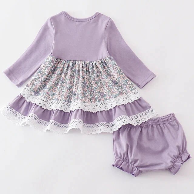 Baby Girl's Lavender Floral Eyelet Ruffle Dress Set. Lavender long sleeve dress back with solid torso and floral tier bottom. Little lavender bloomer shorts.