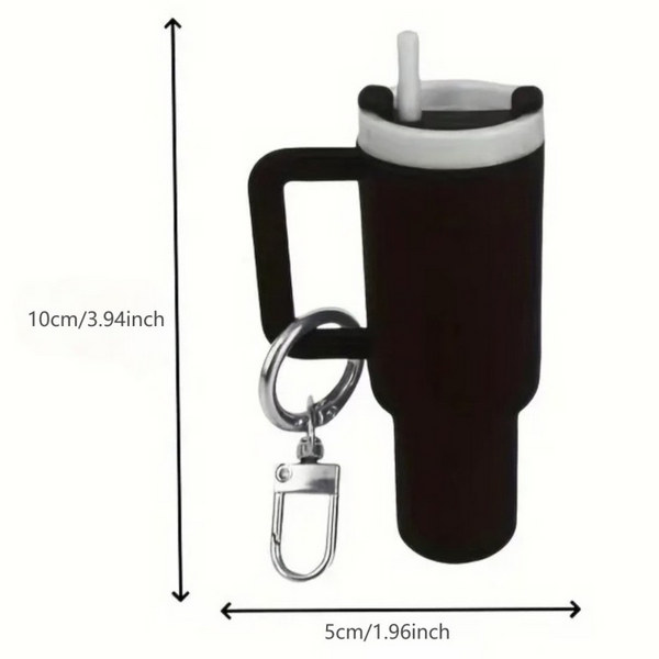 Mini Stanley inspired Tumbler Keychain. Lid screws off. Holds chapstick or small items. Multiple Colors. Metal keyring and lobster clip. Measures 3.94" tall. Little Gift Nook.