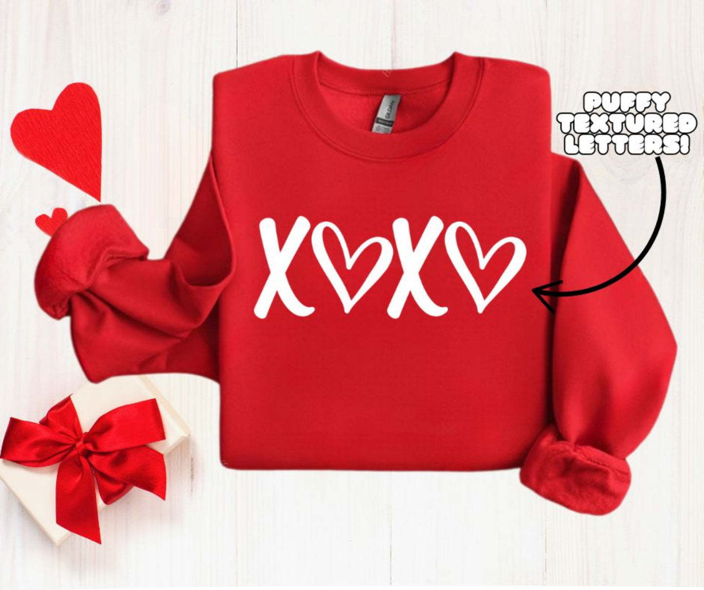 Red XOXO Puffy Letters Crewneck. Unisex fit fleece lined red crewneck sweatshirt with white textured puffy lettering xoxo on front. Makes cute gift. Little Gift Nook.