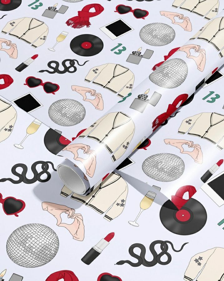 Singer Gift Wrap Wrapping Paper. White red and black wrapping paper with records, cardigans, heart glasses, snakes, red lipstick, heart hands, and disco balls printed on it. - Little Gift Nook