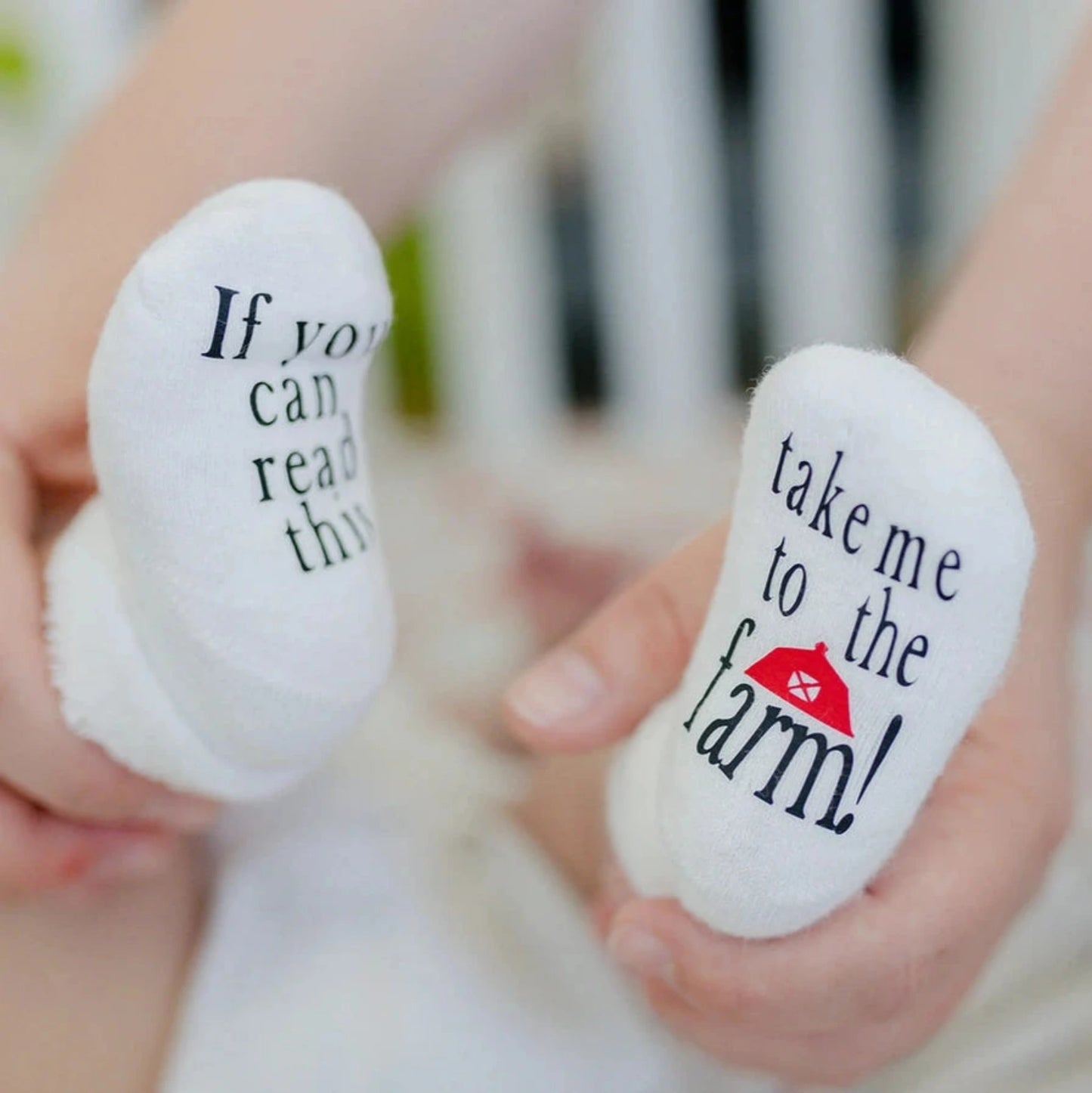 Take Me To the Farm Baby Socks. white baby socks with red barn room and back lettering on both socks.- Little Gift Nook