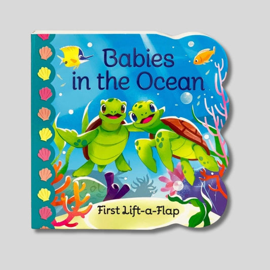 Book cover of 'Babies in the Ocean' lift the flap baby board book with two turtles on a blue underwater background. Little Gift Nook