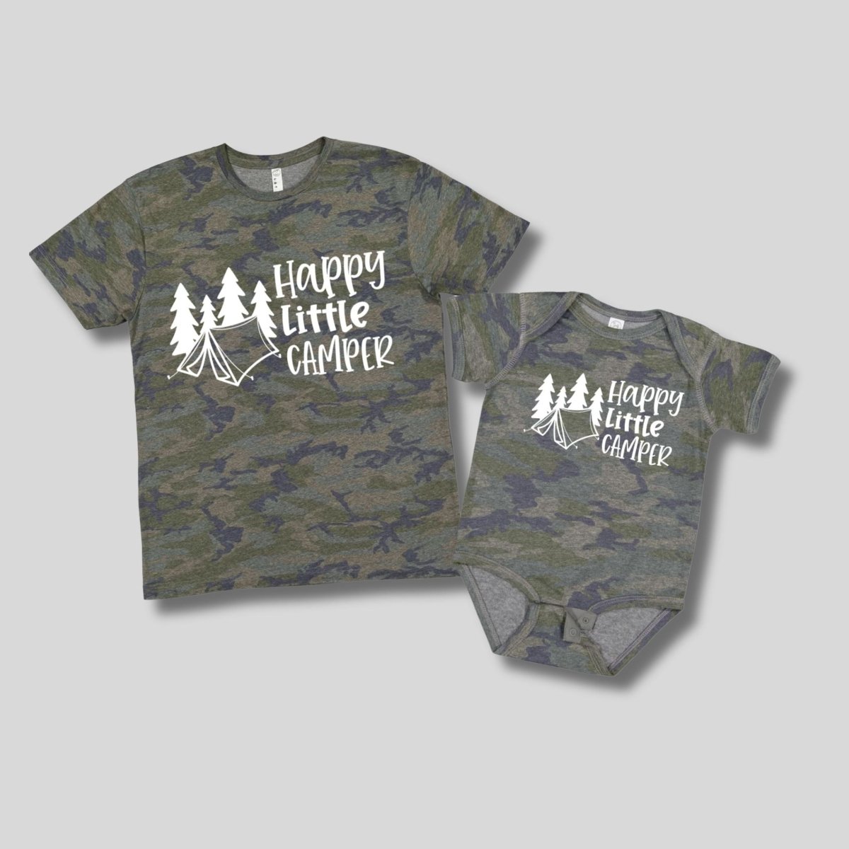 Camo “Happy Little Camper” Baby Onesie or Toddler T-Shirt - green navy camo print short sleeve tshirts and onesies with white lettering and tent trees on front. shirts on gray background- Little Gift Nook