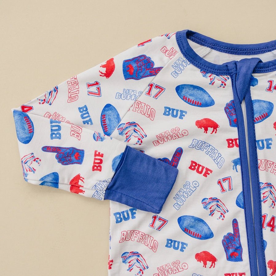 Close up of bamboo baby Buffalo Football sleeper with #17 and #86 and red buffalos. Little Gift Nook