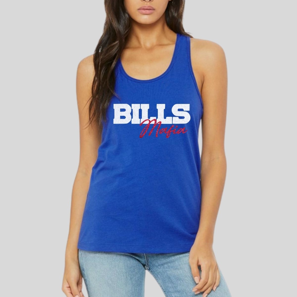 woman wearing royal blue BILLS Mafia glitter tank top standing on gray background. Little Gift Nook