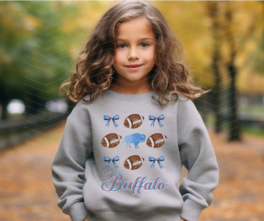 Little Girl in gray sweatshirt with Buffalo Football Blue Bows PNG with watermark and Download without watermark - Little Gift Nook