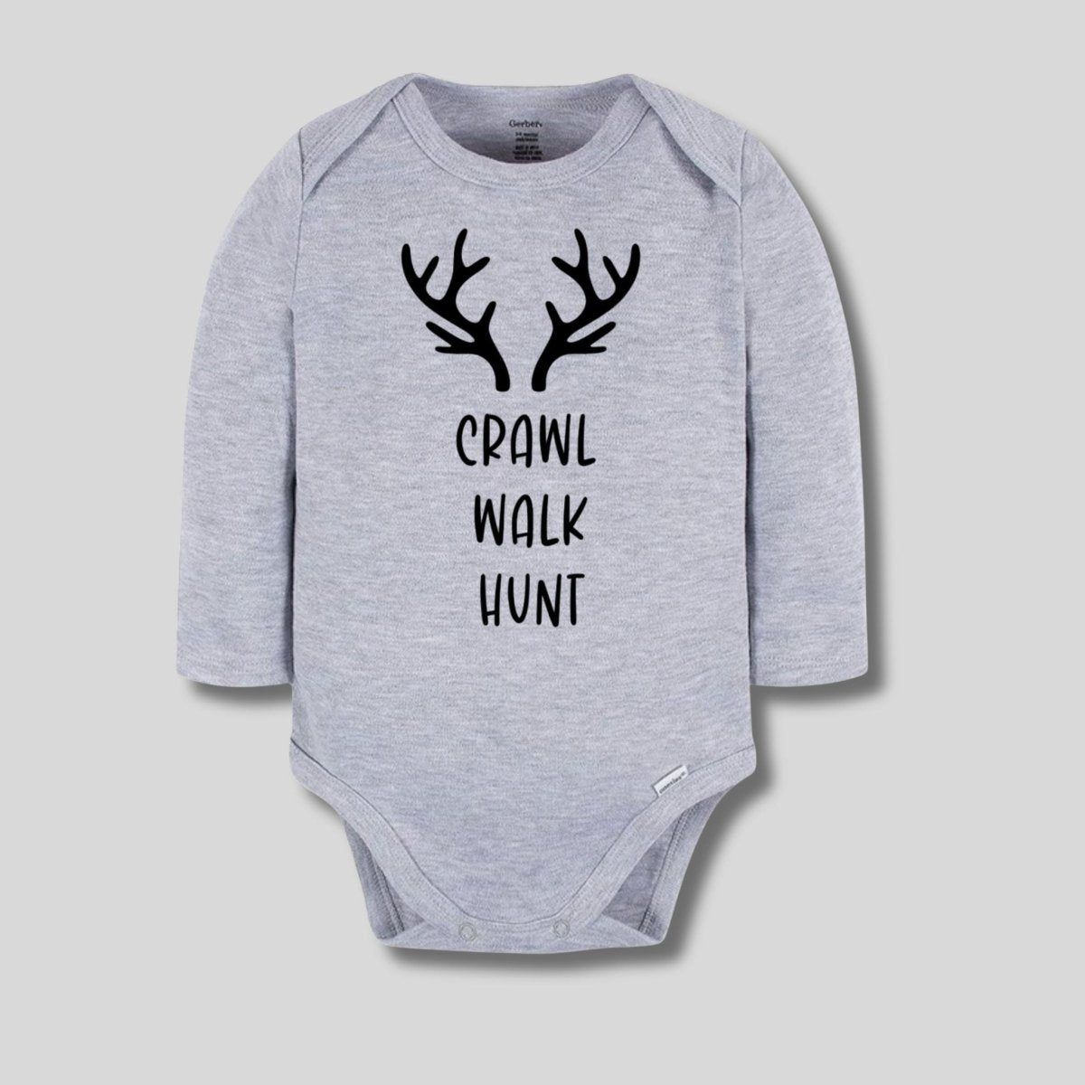 Crawl Walk Hunt Baby Bodysuit. Heather gray long sleeve 100% Cotton bodysuit with black antlers and Crawl, Walk, Hunt on front in black lettering. - Little Gift Nook