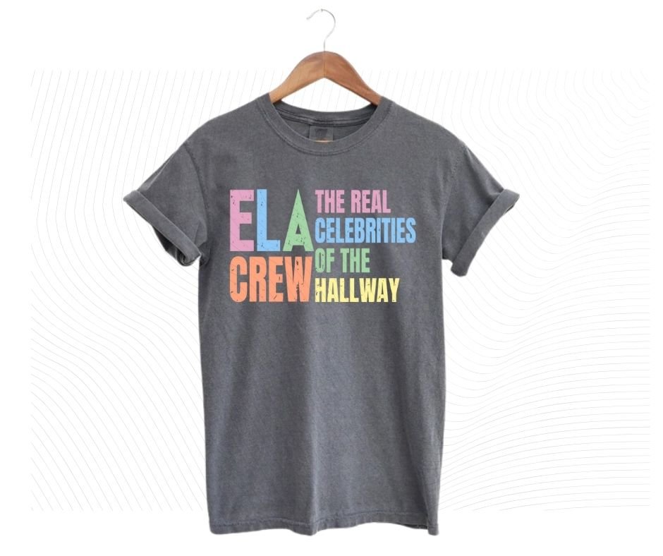 Gray tshirt with colorful digital image with text "ELA Crew. The Real celebrities of the hallway" on front.