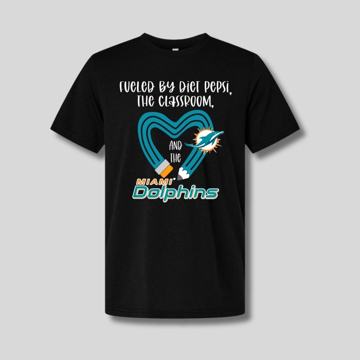 Black tshirt with teal yellow pencil and "fueled by diet pepsi, the classroom, and the dolphins" on front. Little Gift Nook