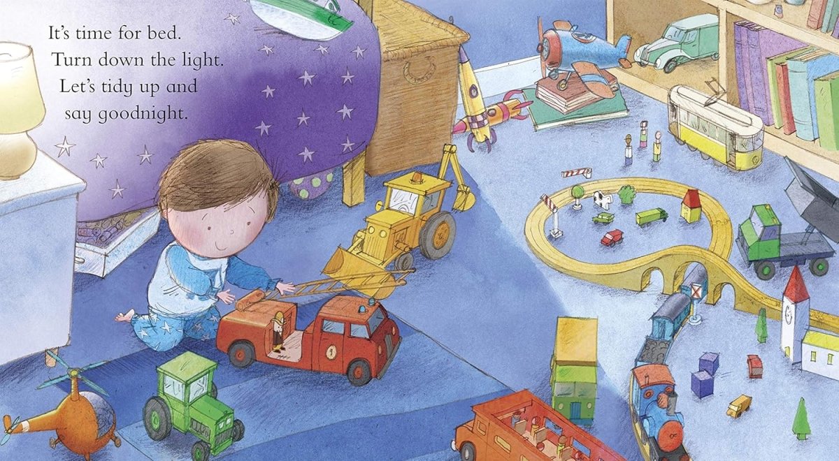 Inside Goodnight Digger book little boy playing with toy vehicles.