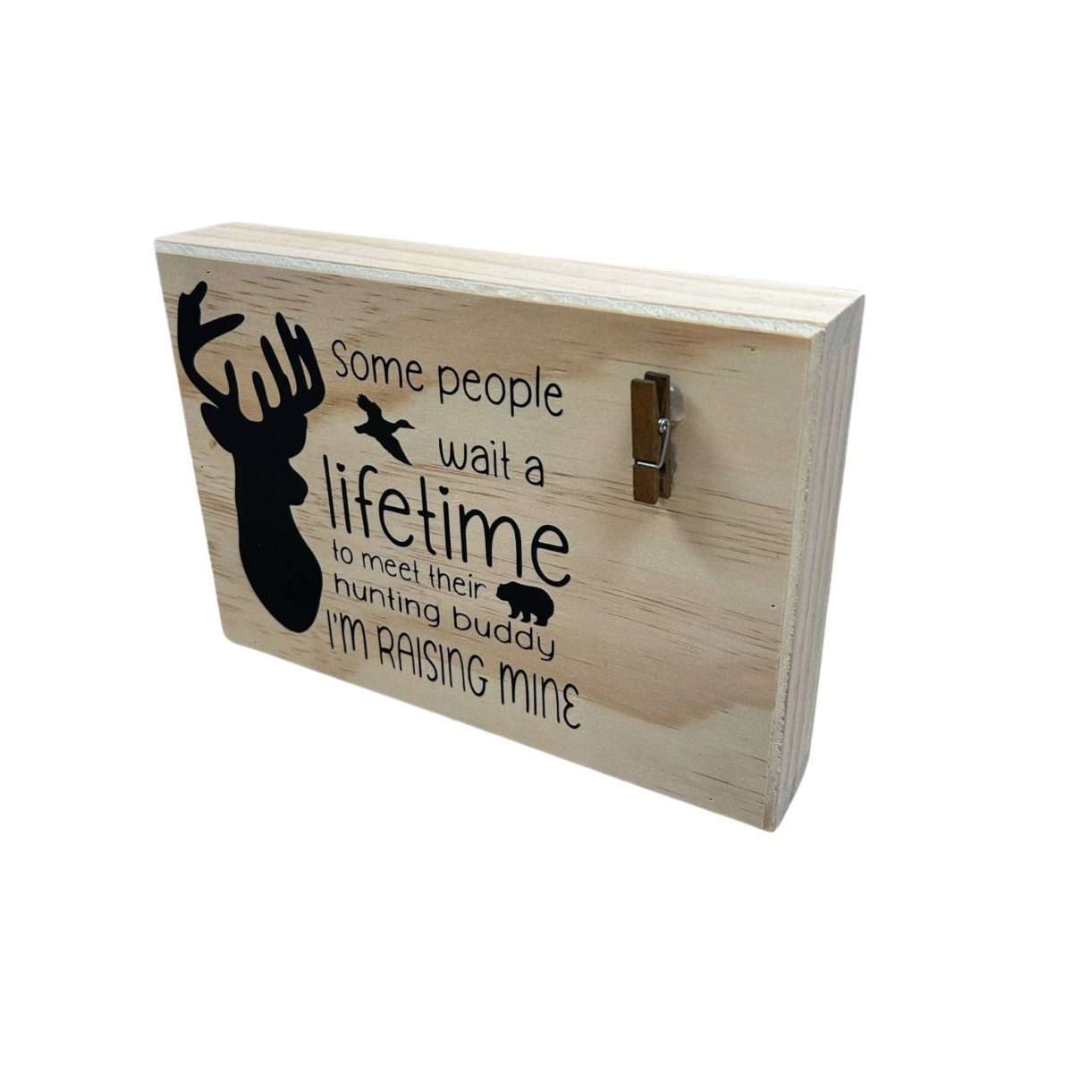Hunting Buddy” Wooden Photo Clip Plaque - 9" x 6" x 1.5" wooden plaque with black vinyl lettering "some people wait a lifetime to meet their hunting buddy. I'm raising mine" with silhouette of buck deer and clip to hold photo - Little Gift Nook