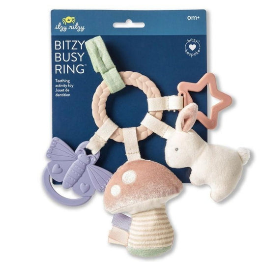 Itzy Ritzy Busy Ring bunny and mushroom Teething Toy with silicone textured teethers, plush toys, and velcro strap to attach to car seat or stroller. Shown on white background - Little Gift Nook