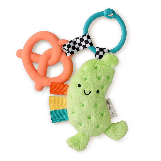 Itzy Pal Parker the Pickle Teether Toy - soft plush green pickle and pink silicone pretzel teether set with sensory taggies on side of pickle. Ring to attach to car seat or stroller - Little Gift Nook
