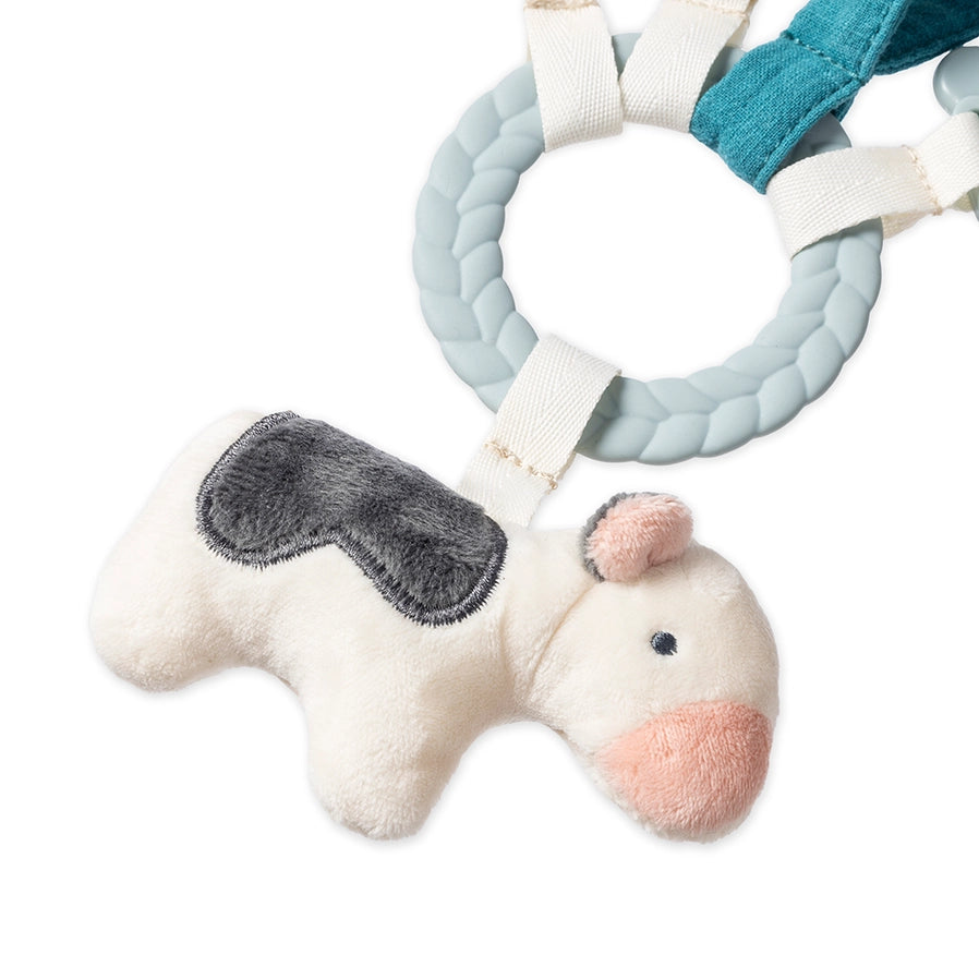 Close up of Itzy Ritzy Busy Ring Farm Teething Toy with silicone teether ring and plush jingle cow - Little Gift Nook