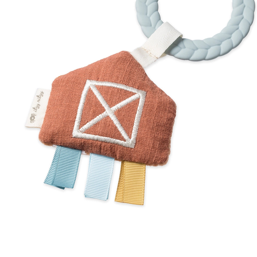 Close up of Itzy Ritzy Busy Ring Farm Teething Toy with plush taggie sensory barn- Little Gift Nook