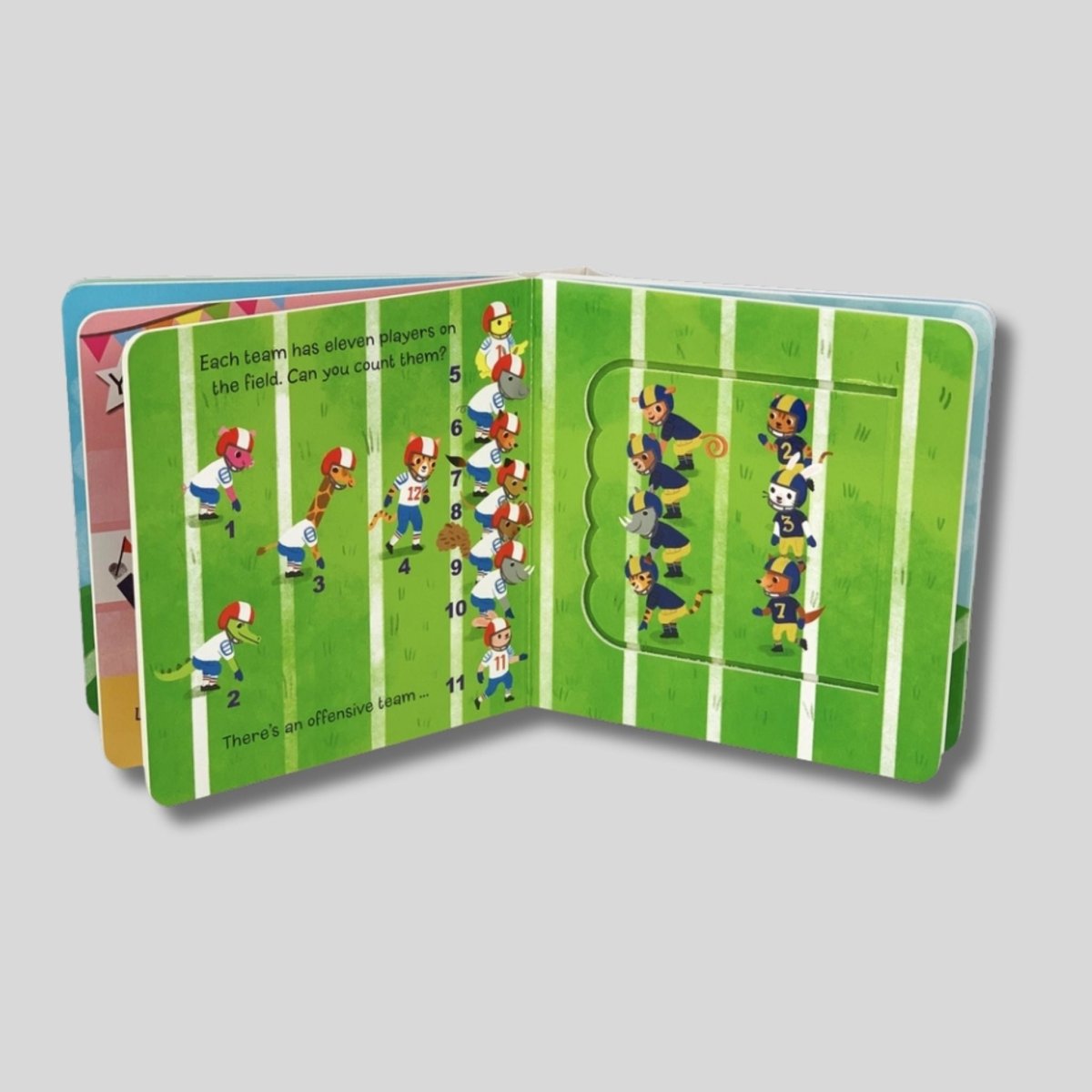 Inside children's lift the flap board book "Let's Play Football" pages showing positions of players on football field.
