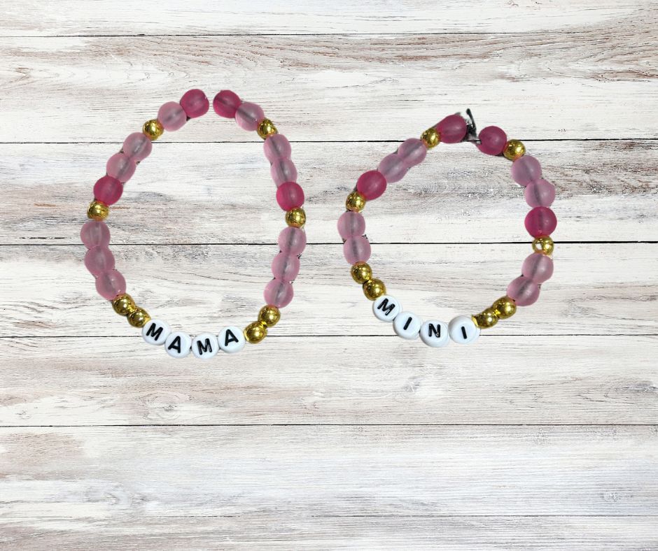 Mama and Mini Matching Beaded Bracelets - pink and gold beads with white round letter beads. One bracelet spells out MAMA other MINI - Little Gift Nook