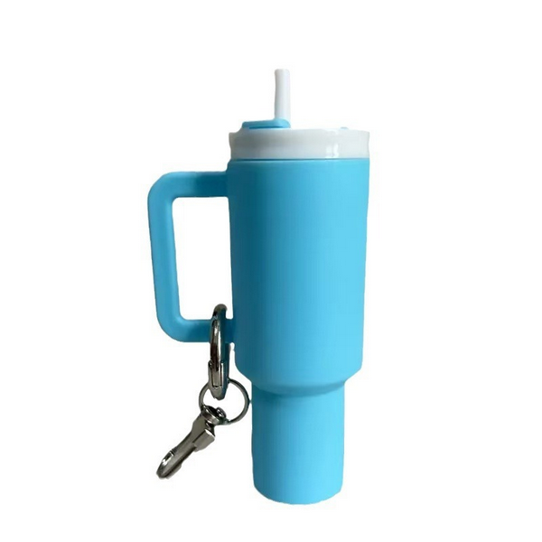 Mini Stanley inspired Tumbler Keychain. Lid screws off. Holds chapstick or small items. Light Blue color. Metal keyring and lobster clip. Little Gift Nook.