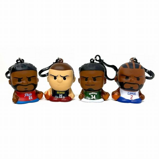 NBA Squeezymates 2025 Mystery Bag Players. 4 slow rise players from different teams with plastic keychain clip standing on white background.