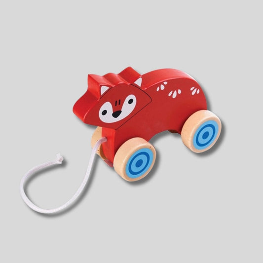 Orange fox child's pull toy with string on light gray background. Little Gift Nook