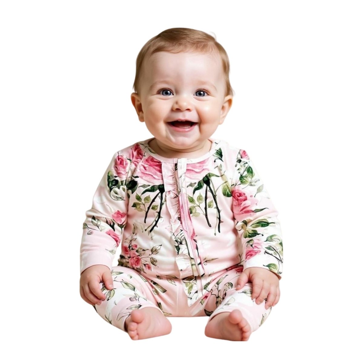 baby sitting in pink floral ruffle bamboo sleeper on white background. Little Gift Nook