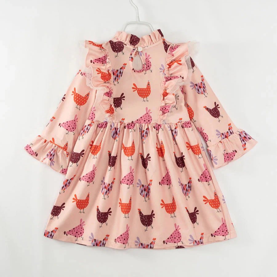 Girl's Pink Hen Chicken Dress. Pink dress with purple, pink and orange chickens and hens print. Back view with button at neck. Little Gift Nook.