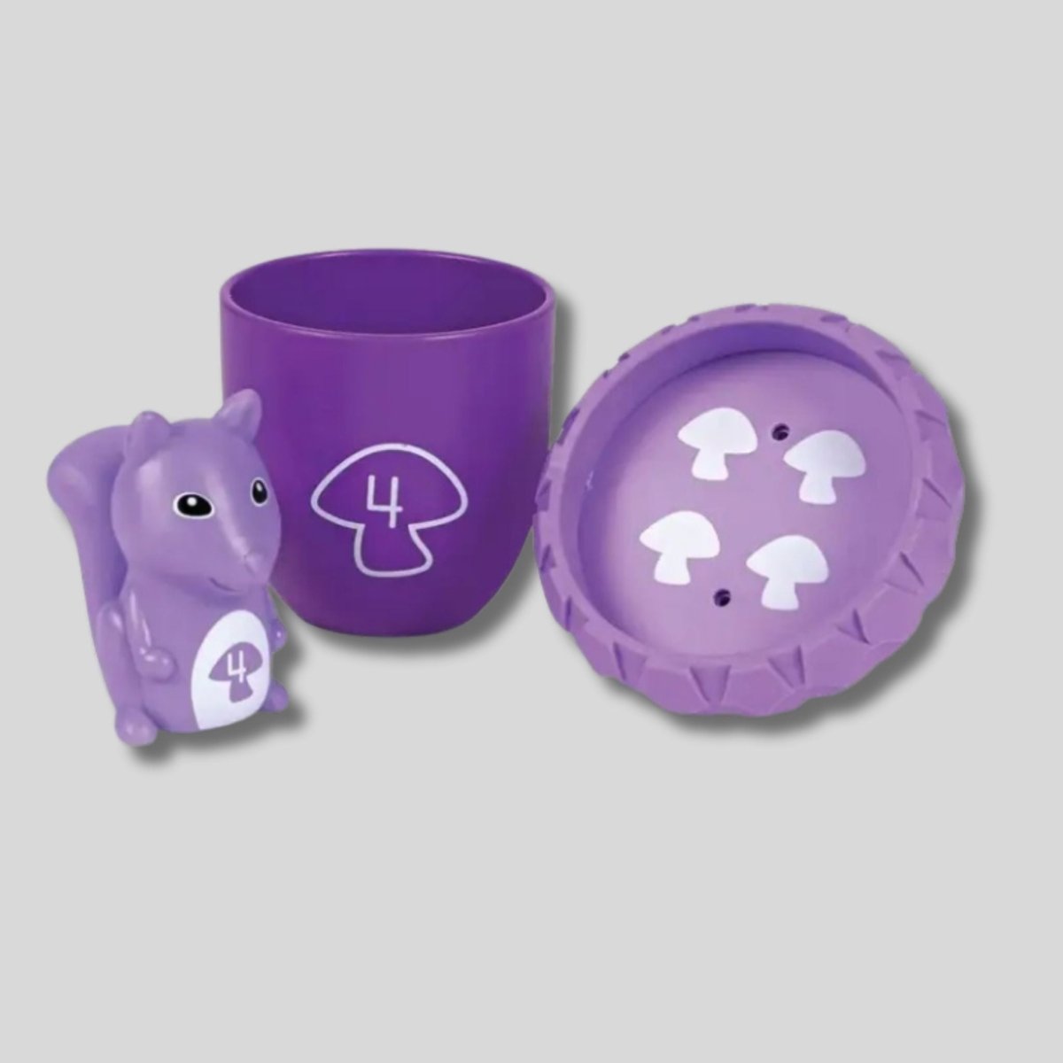 Learning Resources snap n learn surprise squirrels 3 pieces: squirrel, acorn base and lid in purple.