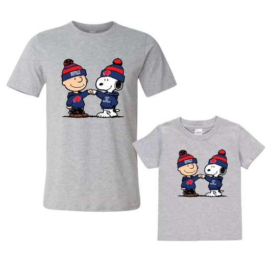 Two gray t-shirts with cartoon characters wearing blue and red Buffalo Football gear. Adult and kids shirts on white background.