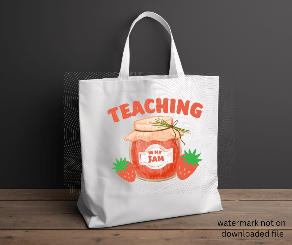 White tote bag with 'Teaching is my jam' design featuring a jar of red jam and strawberries on a dark gray background.