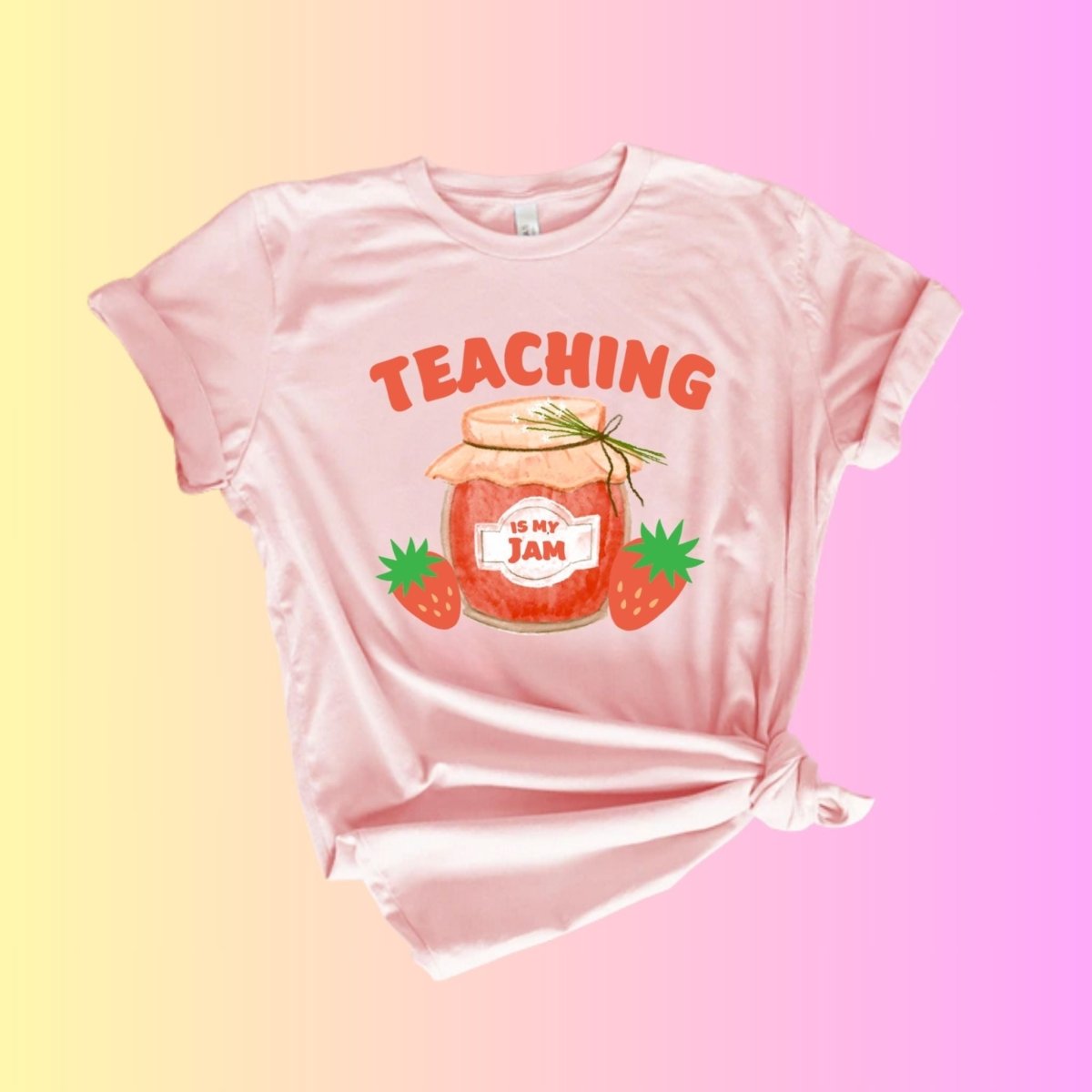 pink corner tied tshirt with pink/red jam jar and "teaching is my jam" on front. Pink yellow background.