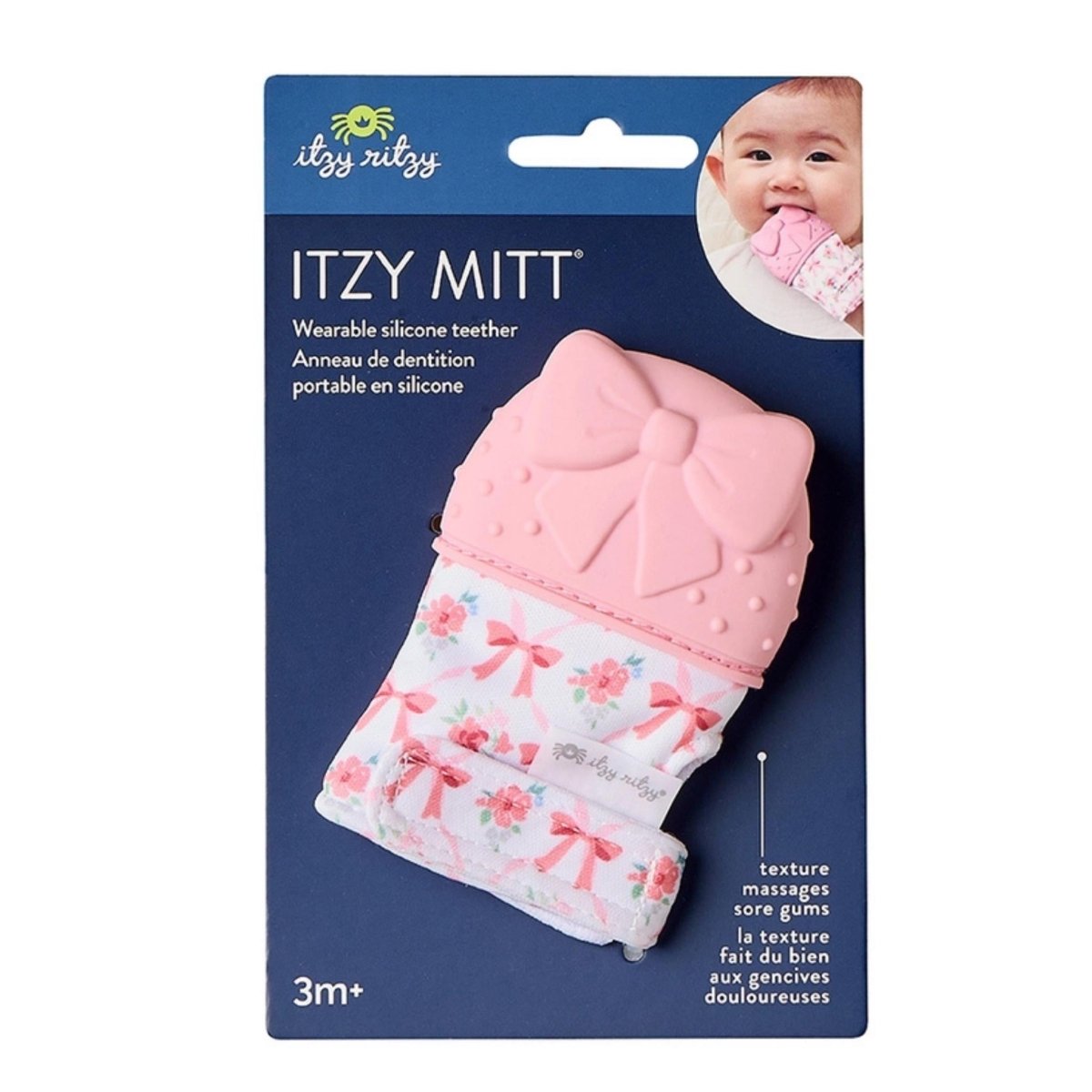 Itzy Mitt wearable pink bow silicone teething mitt teether in package showing baby. Little Gift Nook