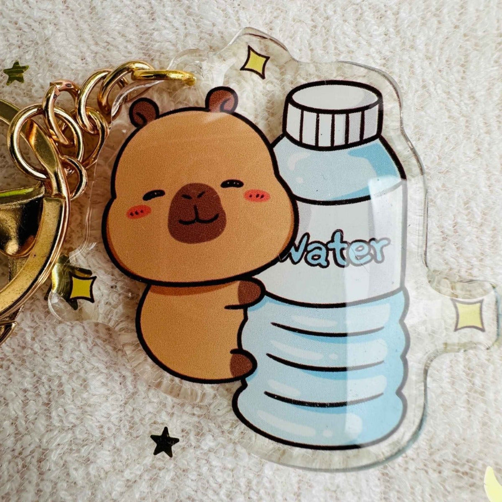 Capybara holding water Capybara Acrylic Keychains. Double sided. Comes with metal keyring and hook. Little Gift Nook.