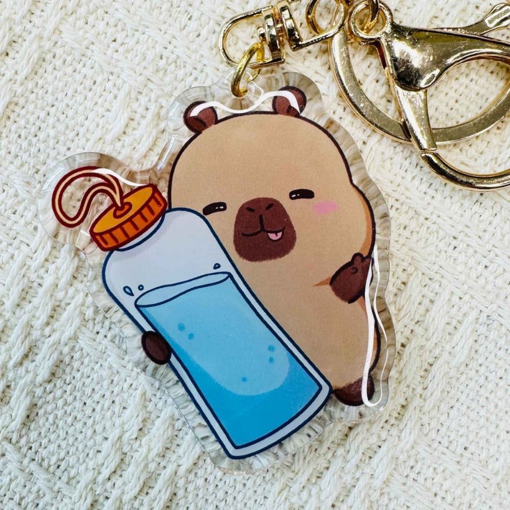 Capybara with water bottle Capybara Acrylic Keychains. Double sided. Comes with metal ring and hook. Little Gift Nook.