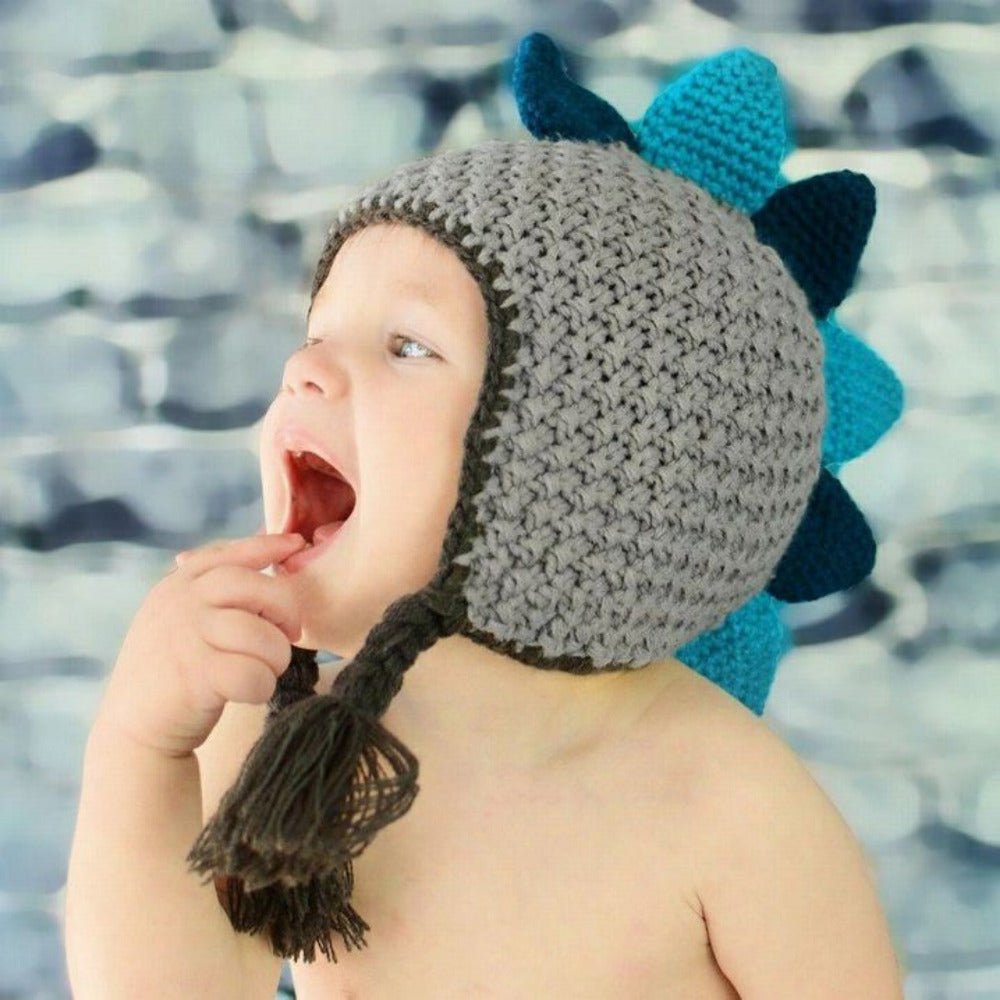 Baby wearing Dinosaur knit Beanie Hat. Gray knit hat with teal and green spikes at top.- Little Gift Nook