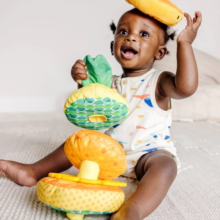 Melissa & Doug Pineapple Soft Stacker for baby. Soft textured pieces and teether piece in center. All removable and stackable on base. - Little Gift Nook