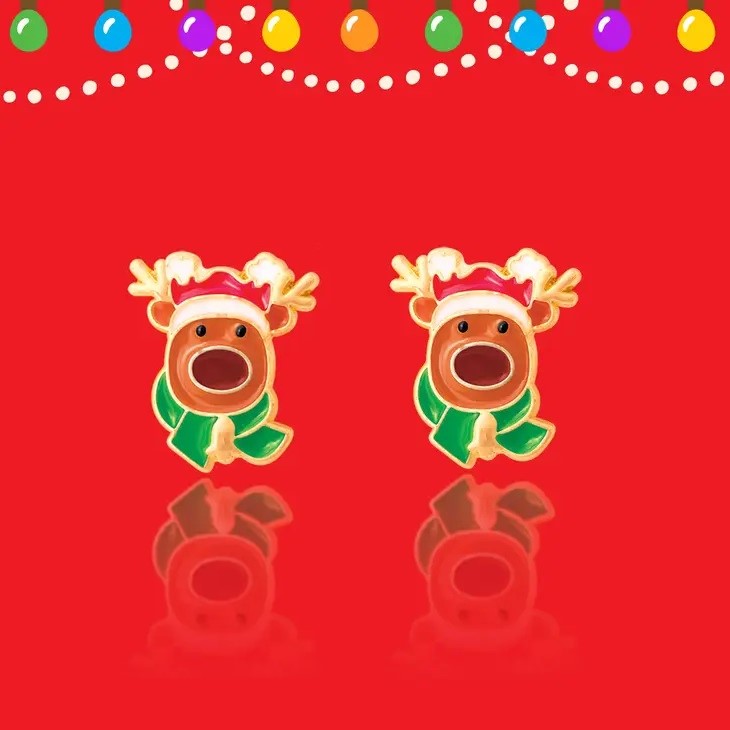 Reindeer Magic Pierced Earrings. Close up of Reindeers wearing santa hats and in green scarves earrings. - Little Gift Nook
