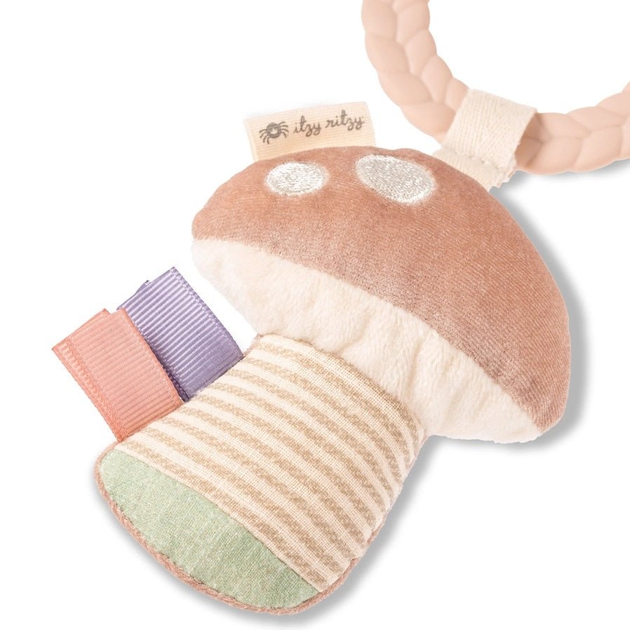 Close up of Itzy Ritzy Busy Ring soft taggy plush mushrom on ring teething toy.