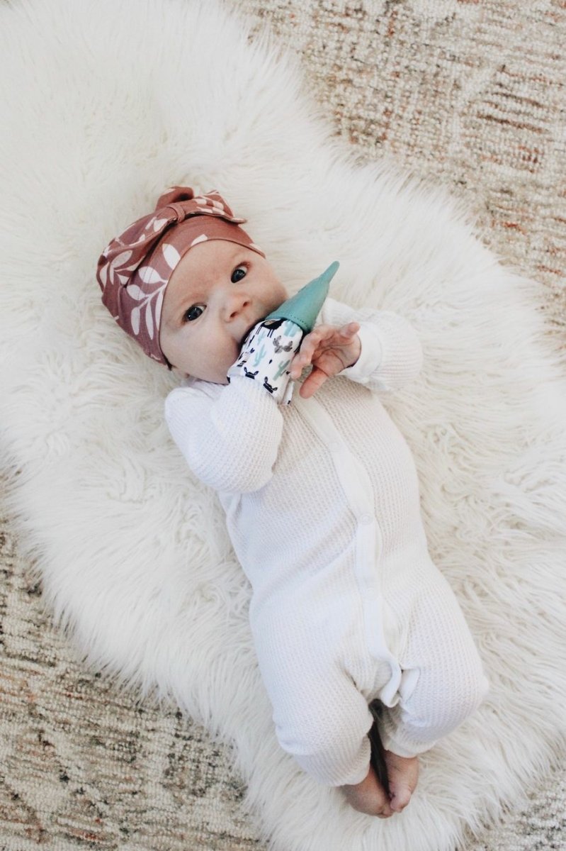 Baby using Itzy Ritzy Teething Mitt Teal Llama - Little Gift Nook